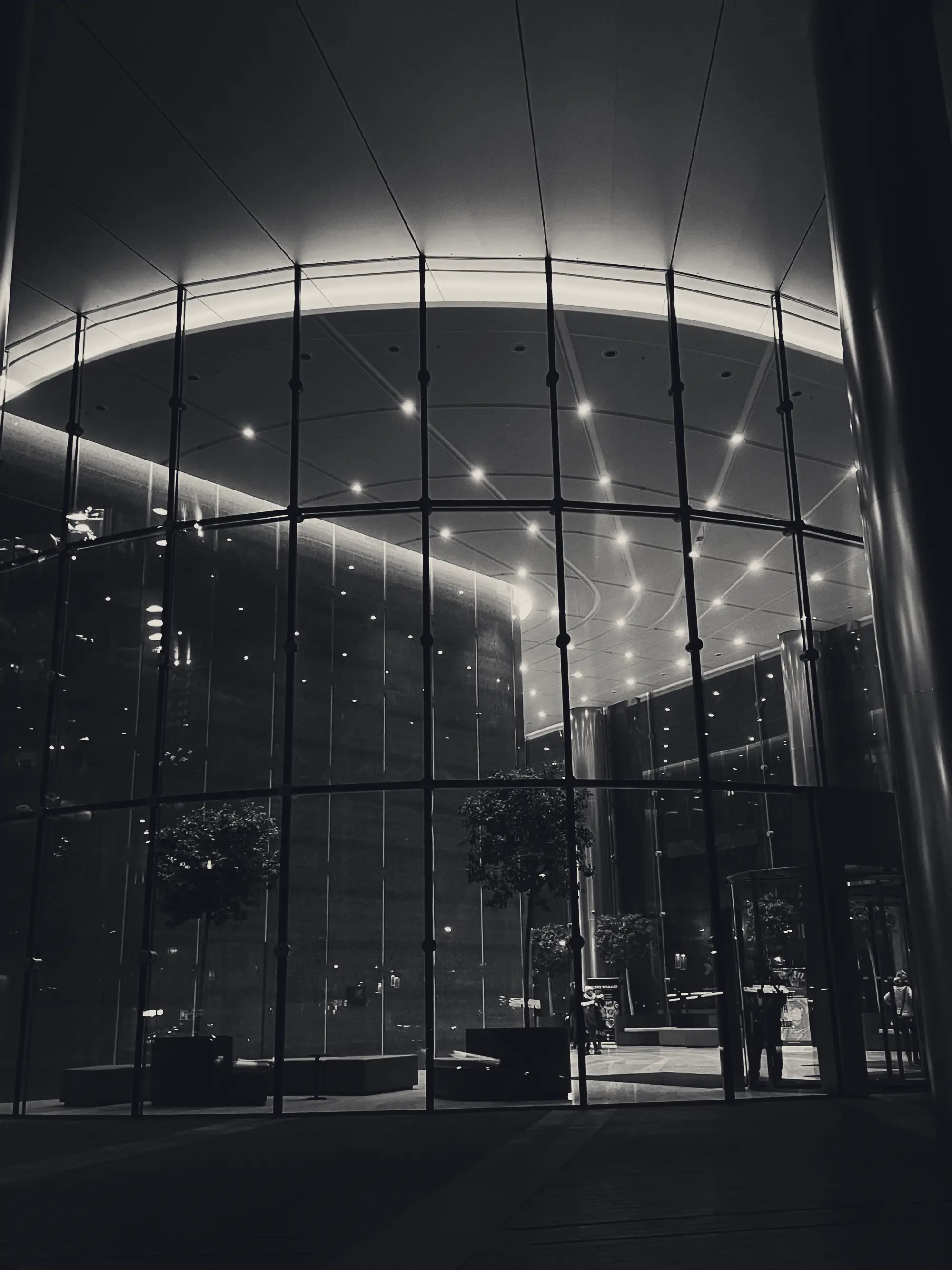 Illuminated glass building at night